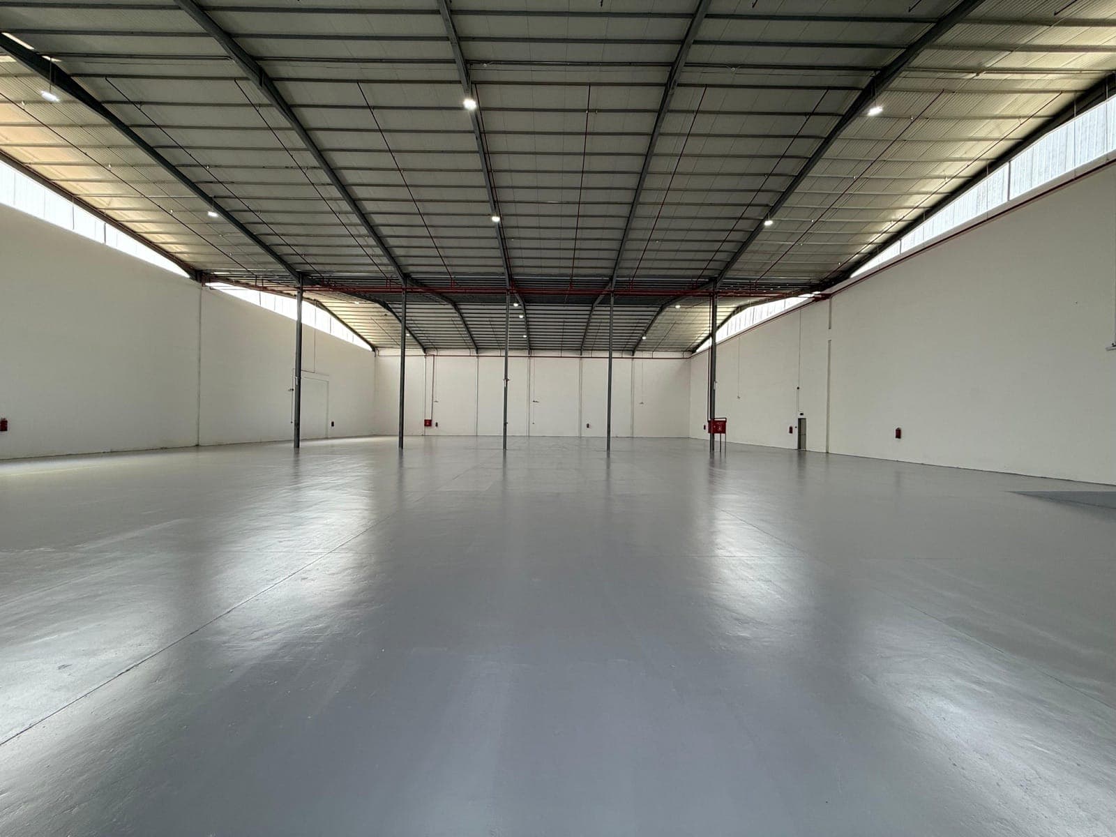 Indoor storage space with height suited to material handling