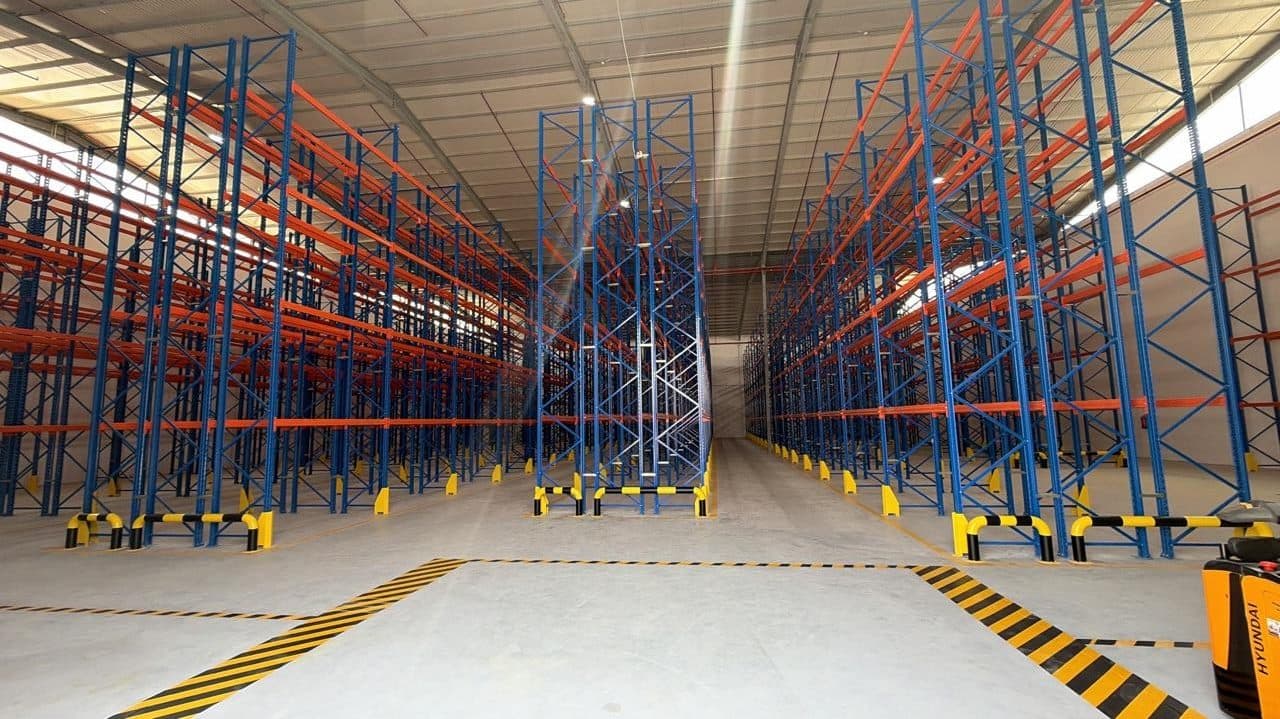 Warehouse fitted with steel pallet racking for goods